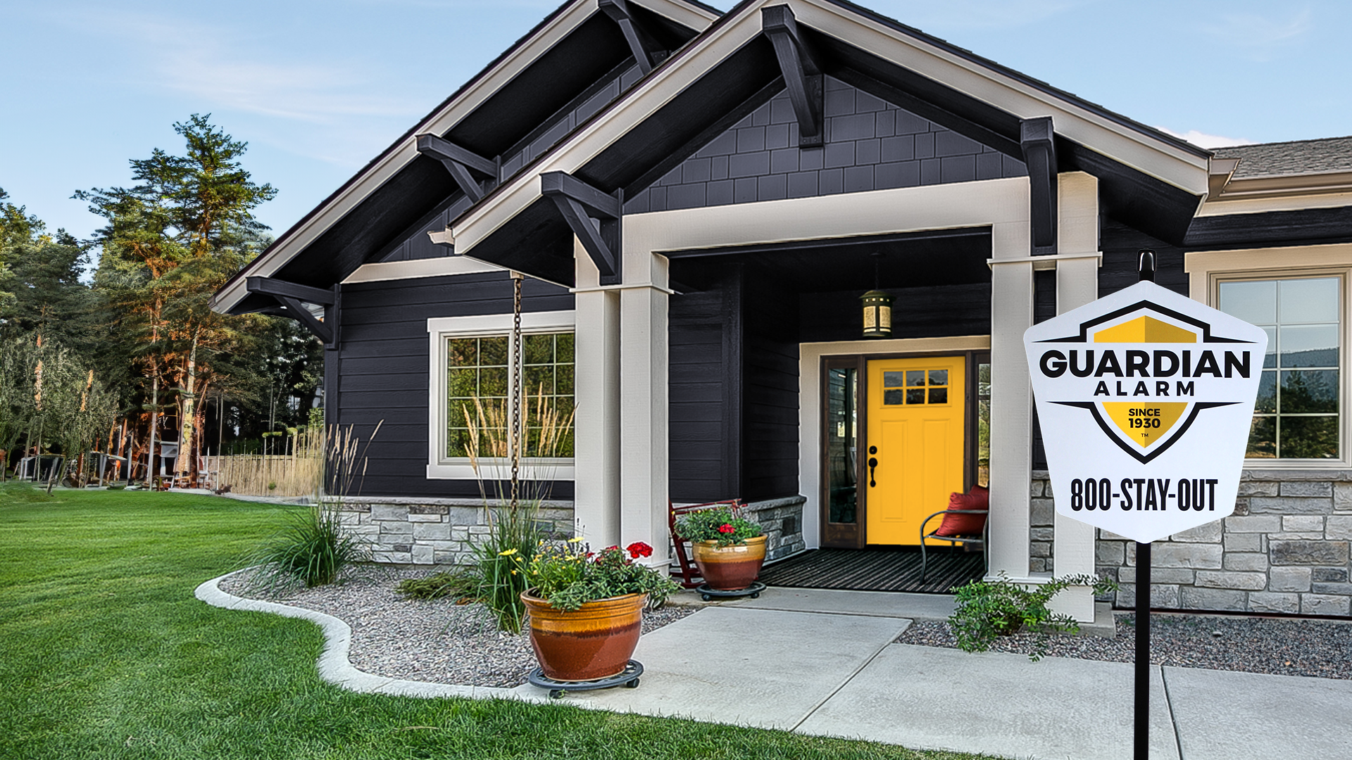 Front door view with guardian alarm sign in the yard