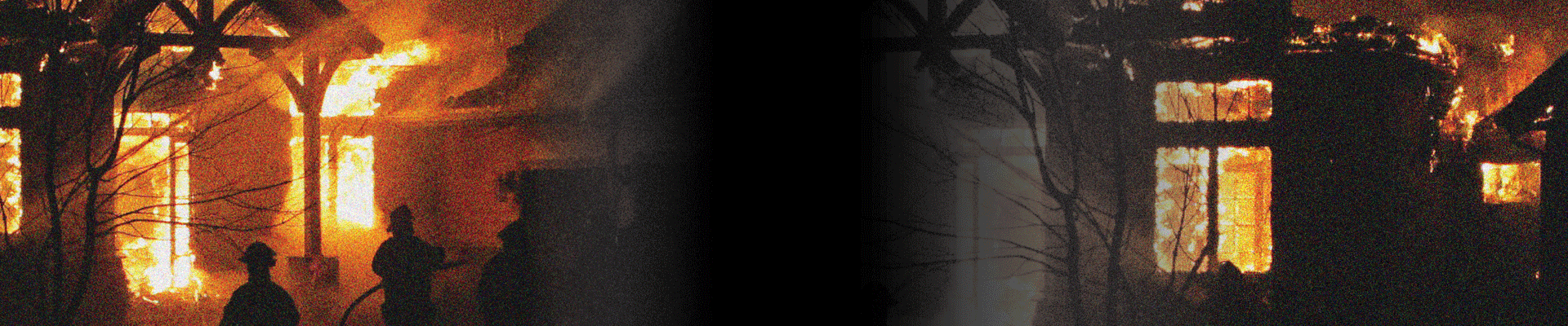 Home engulfed in flames with a firefighting crew working to extinguishing them during the night